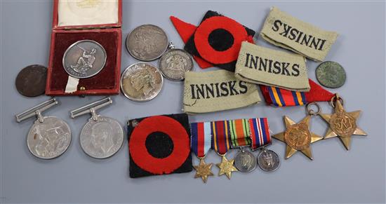 A quantity of medals, coins and badges